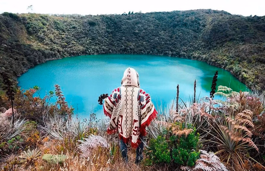 The green crater lake of Guatavita seen from the rim