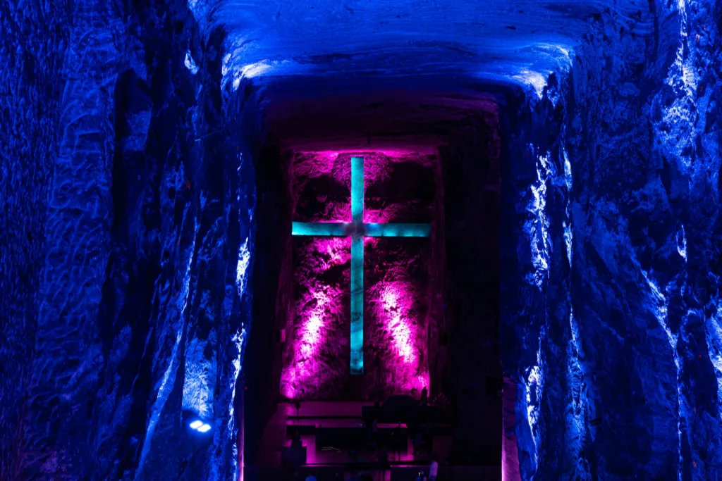 The illuminated cross carved into the salt rock of the main chamber at Zipaquira The illuminated cross carved into the salt rock of the main chamber at Zipaquira