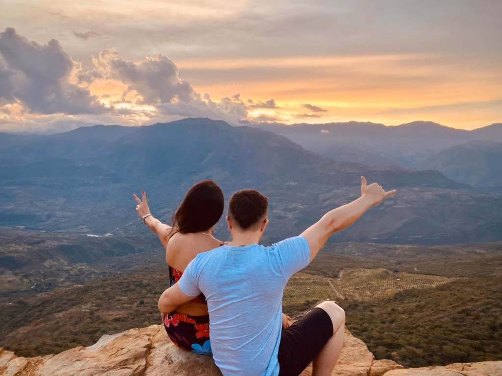 Travellers at a sunset viewpoint over the Santander canyon