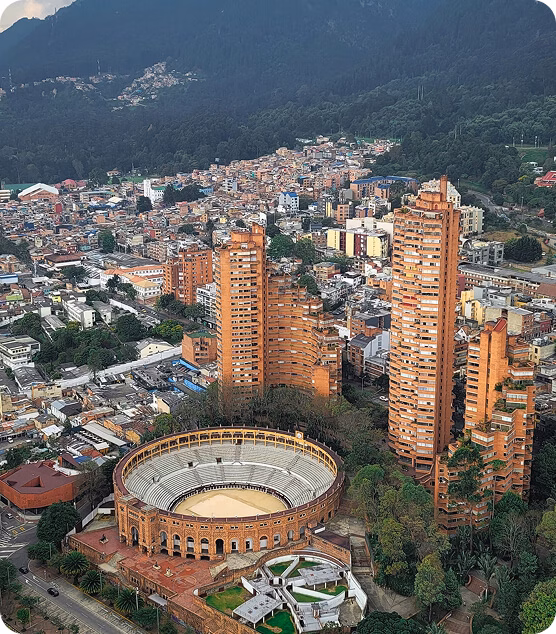 Historic Bogotá street with colonial buildings and tourists walking.